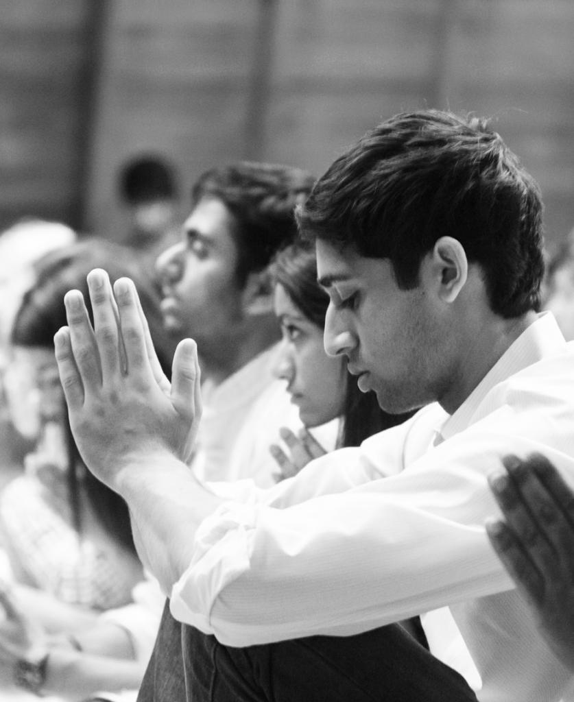 Worshipping together: A SLU student prays during the Divali celebration in DuBorg Hall. Ryan Quinn / Photo Editor